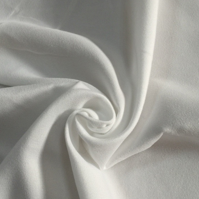 Hvad er polyester ferskenskindsstof præcist, og hvordan får det sin tekstur?